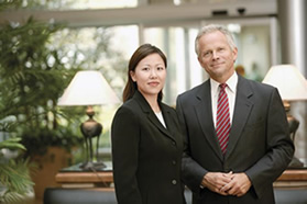 A man and woman in suits.